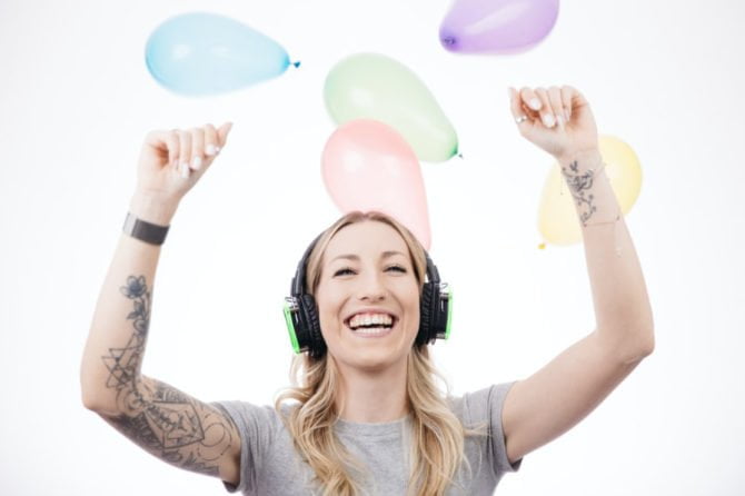 girl with balloons and headphones
