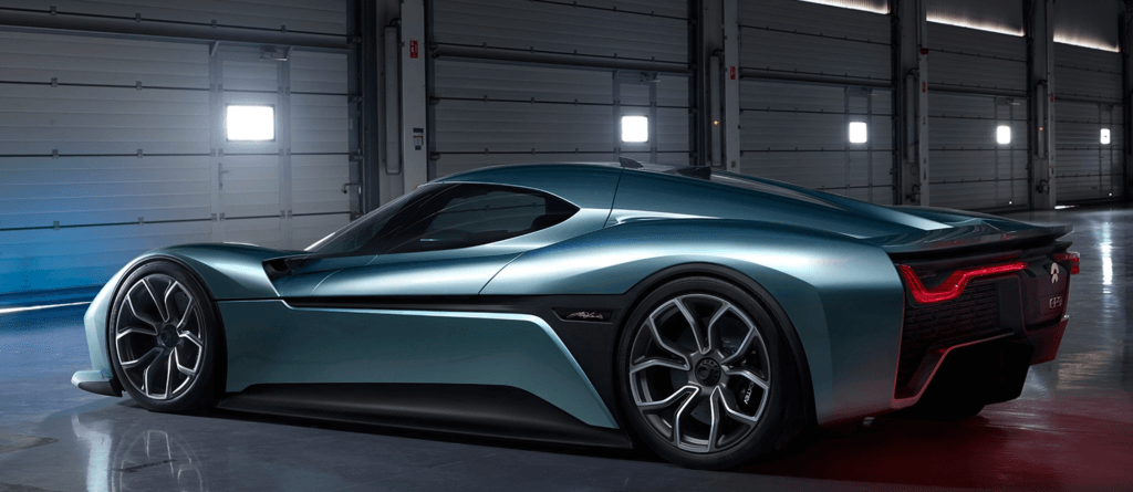 a blue sports car in a garage